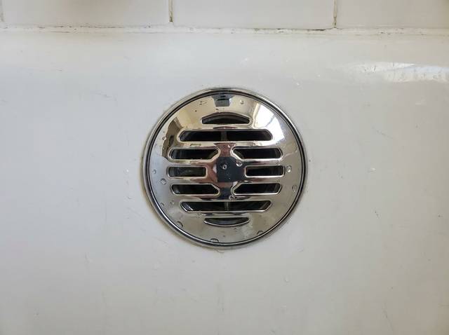 Bathroom 1 shower drain close-up, no hair